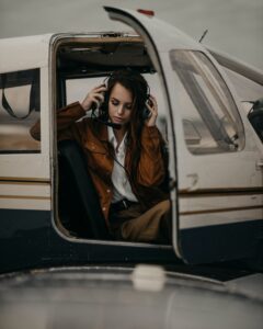 woman in plane with door open
